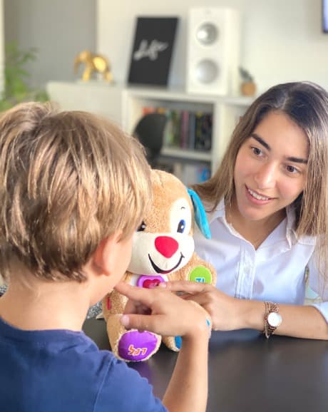 Mai Shahar, speech-language pathologist, working with a child using play-based therapy techniques